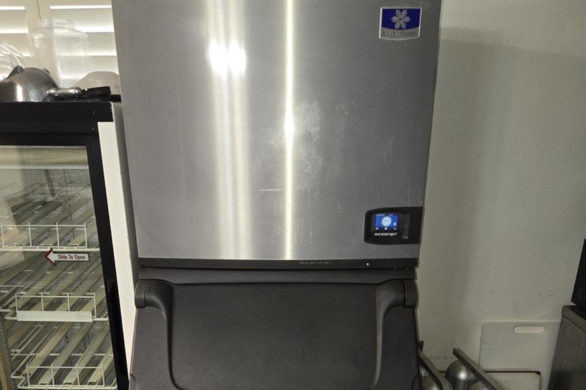 Manitowoc IndigoNXT commercial ice machine and storage bin in a restaurant kitchen, serviced by Panda Heating and Cooling in Celina, TX
