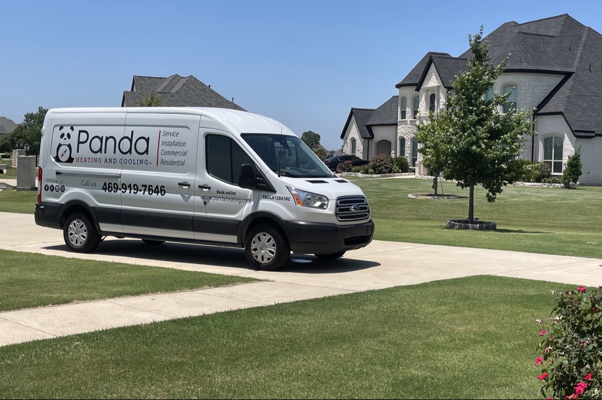 Panda Heating and Cooling service van in a Pilot Point, TX neighborhood, showing the phone number 469-919-7646 and Texas license TACLA128438C