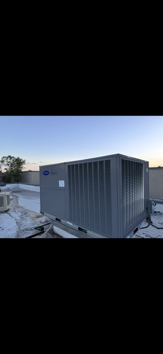 Roof-top unit being installed and connected by Panda Heating and Cooling in Celina, TX